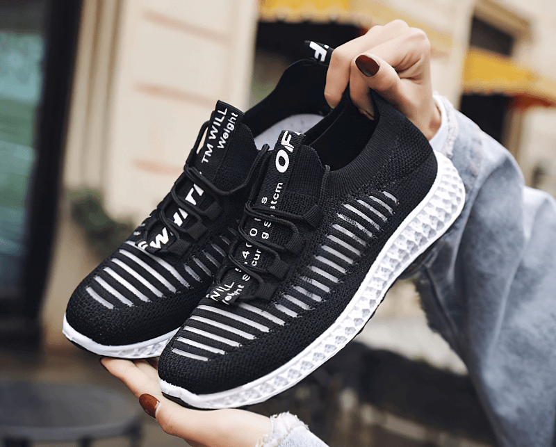 Stylish black mesh breathable lace-up sneakers for women with flat bottoms, ideal for casual wear and walking.